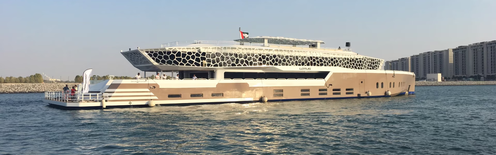 Luxury mega yacht cruise Dubai at sunset in Dubai Marina during a Lotus Marina cruise – showcasing the elegance of a Dubai sunset yacht tour.