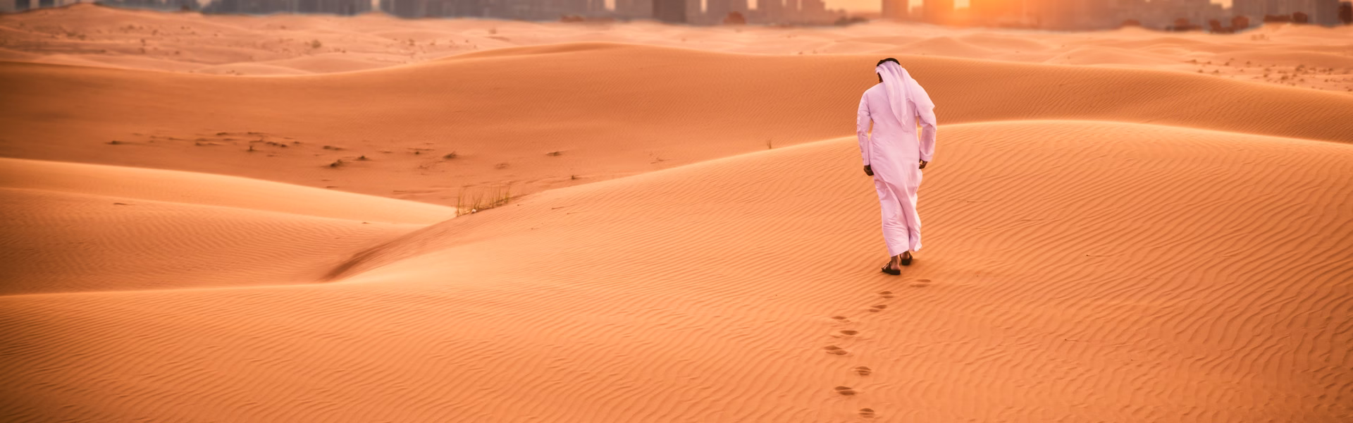 Tourists enjoying a top rated desert safari Dubai UAE with dune bashing, camel rides, and sunset views in a good desert safari in Dubai.
