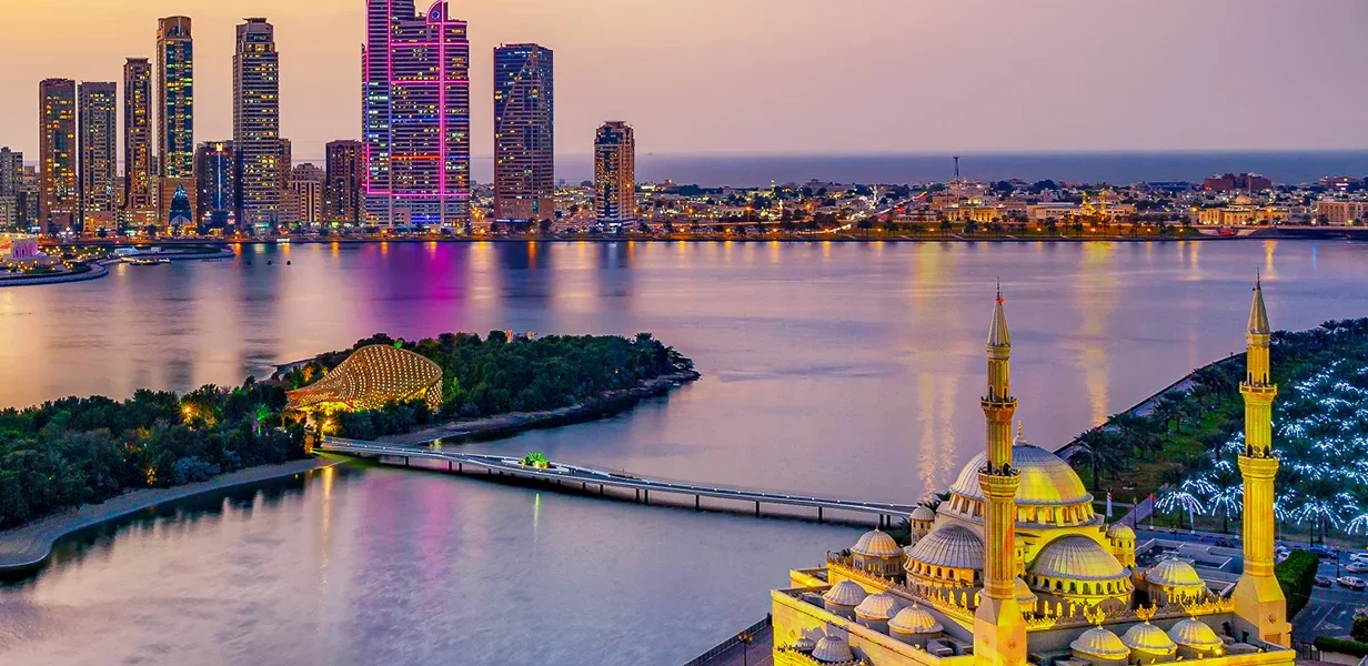 Tourists enjoying a City Tour Sharjah, visiting cultural landmarks and engaging in authentic Sharjah sightseeing during a guided Sharjah tour experience.