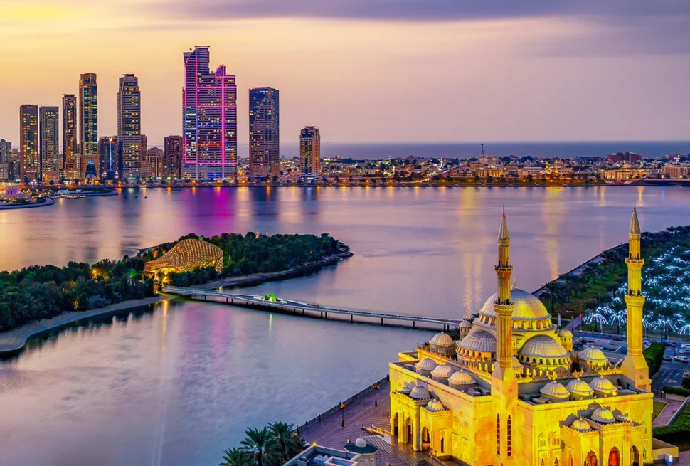 Tourists enjoying a City Tour Sharjah, visiting cultural landmarks and engaging in authentic Sharjah sightseeing during a guided Sharjah tour experience.
