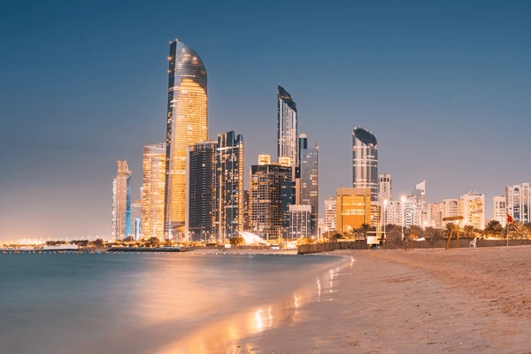 Golden Sunrise and Sunset in Abu Dhabi over city skyline