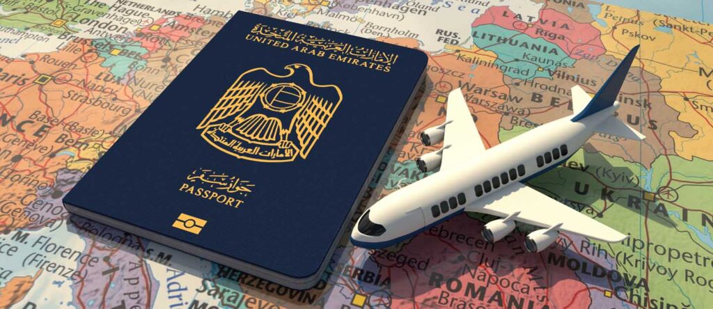 Traveler in Dubai holding passport and visa documents, representing 30 days inside country visa change process without exit.