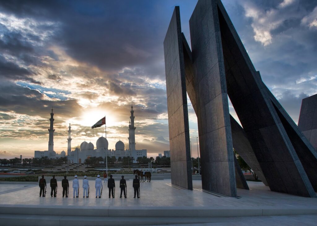 Golden Sunrise and Sunset in Abu Dhabi over city skyline