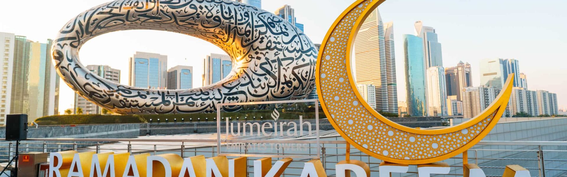 Ramadan market in Dubai at night with lanterns, food stalls, and families shopping
