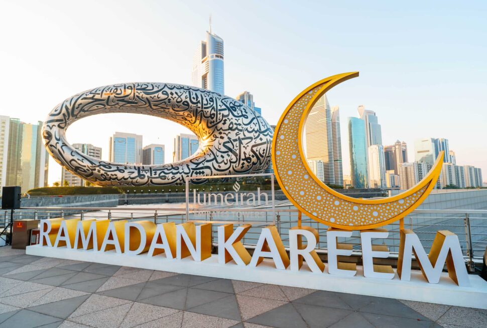 Ramadan market in Dubai at night with lanterns, food stalls, and families shopping