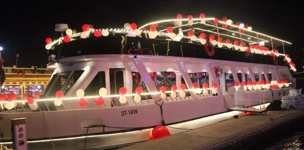 Dubai Luxury Canal Dinner Cruise with skyline view and luxury dhow under lights