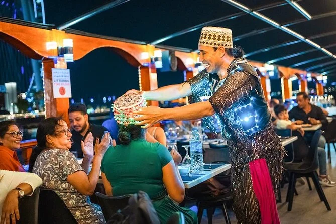 Traditional dhow cruise creek with dinner under Dubai’s evening skyline