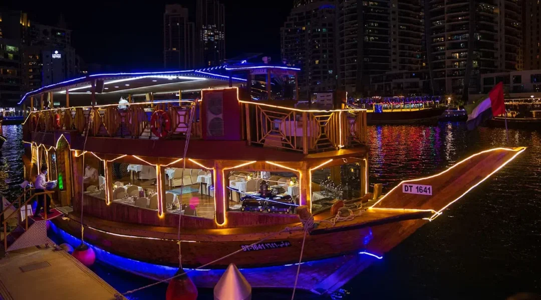 Traditional dhow on Dubai Creek during a sunset creek dhow cruise tour