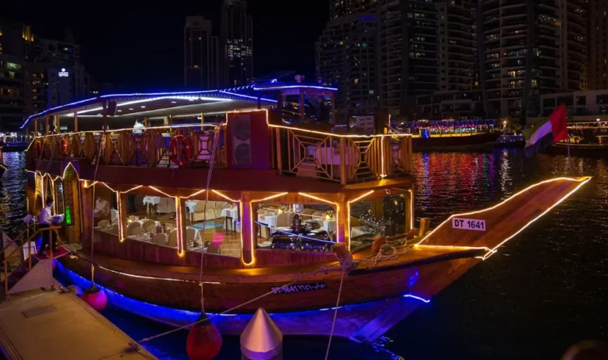 Creek Dhow Cruise Tour | 1 Chance To See Dubai Differently | #HiddenDubai › Forever Tourism LLC Traditional dhow on Dubai Creek during a sunset creek dhow cruise tour