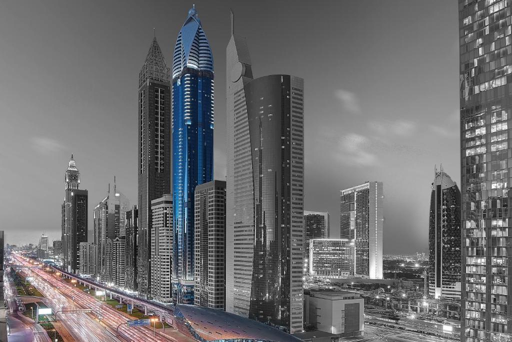 › Forever Tourism LLC Panoramic skyline showcasing Gevora Hotel and Burj Al Arab among the world’s tallest hotels.