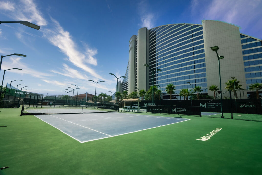 Modern outdoor Padel Tennis court in Dubai with skyline in the background
