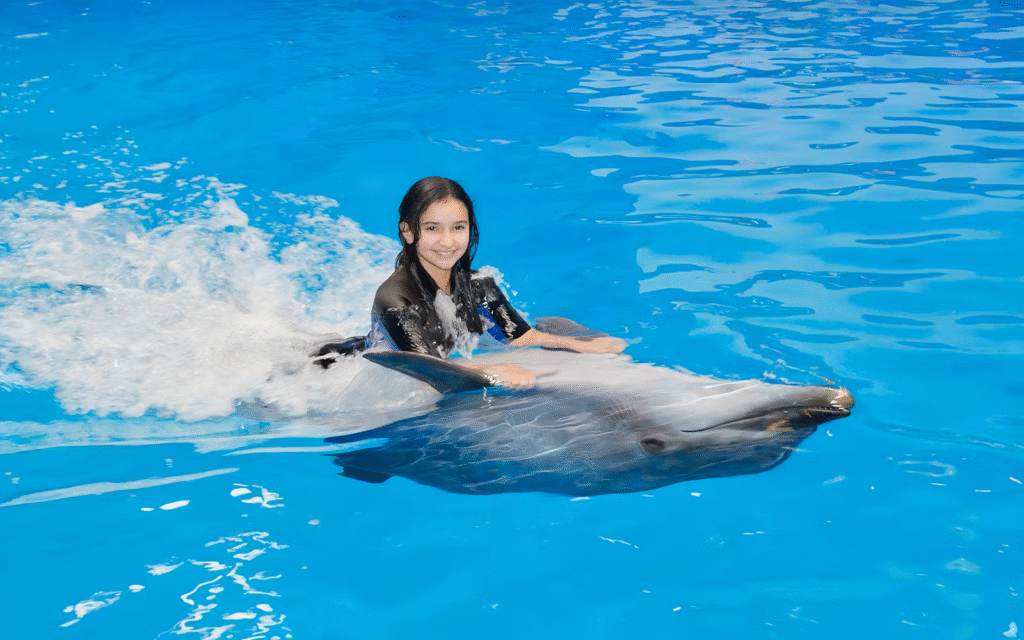 › Forever Tourism LLC Family enjoying front-row dolphin show with confirmed ticket dolphinarium