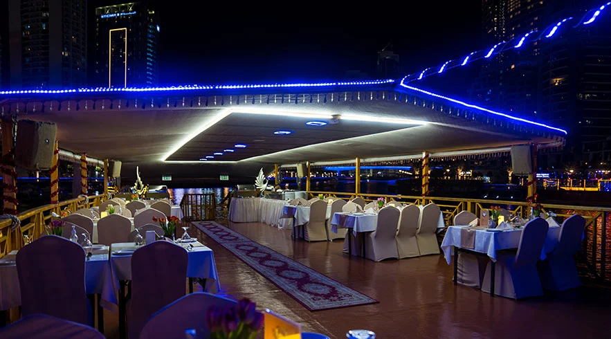 Traditional dhow on Dubai Creek during a sunset creek dhow cruise tour