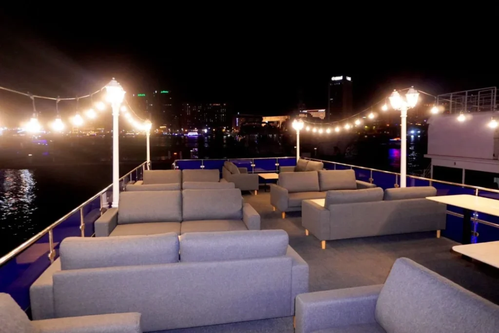 Dubai Luxury Canal Dinner Cruise with skyline view and luxury dhow under lights