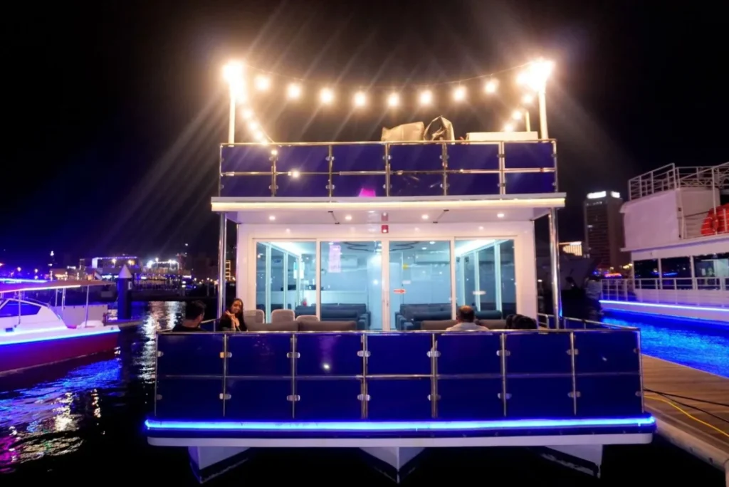 Dubai Luxury Canal Dinner Cruise with skyline view and luxury dhow under lights