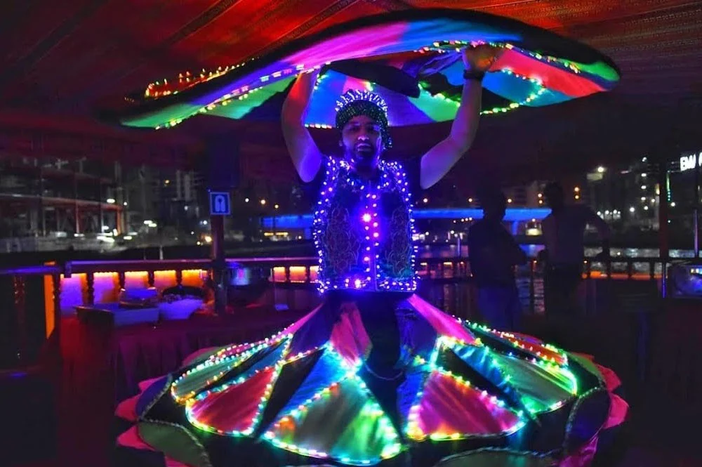 Traditional wooden dhow sailing through Dubai Canal at night – Dubai Canal Dhow Cruise