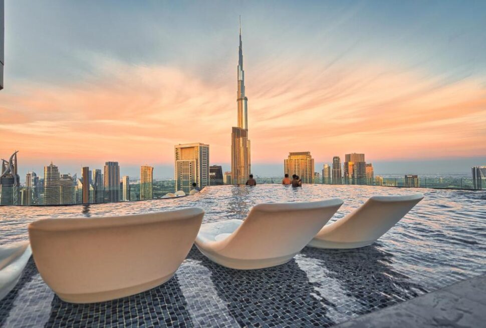 Dubai Pool Days: Luxurious poolside view at a premium Dubai resort with cabanas and skyline in the background.