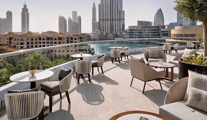 Family enjoying Easter brunch at locations in Dubai to celebrate Easter by Burj Khalifa with colorful decorations and eggs.