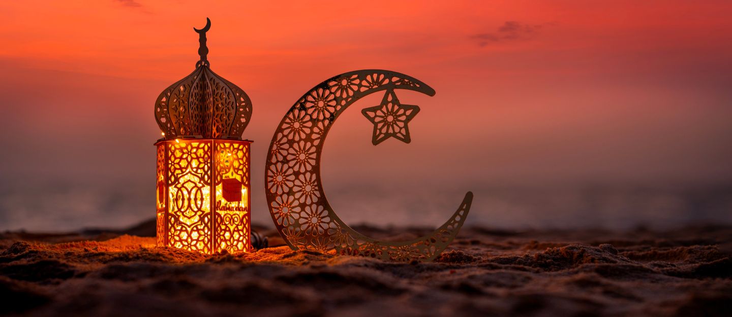 Beautiful Ramadan street scene in Dubai at sunset showing lanterns, traditional decorations, and a festive ambiance