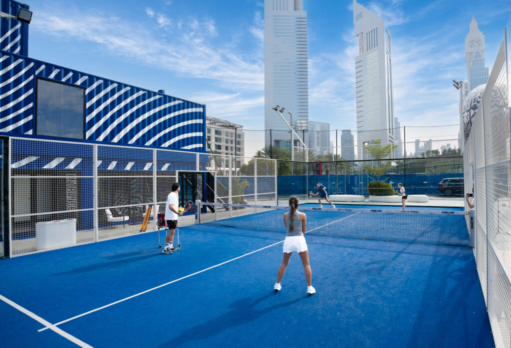 Modern outdoor Padel Tennis court in Dubai with skyline in the background