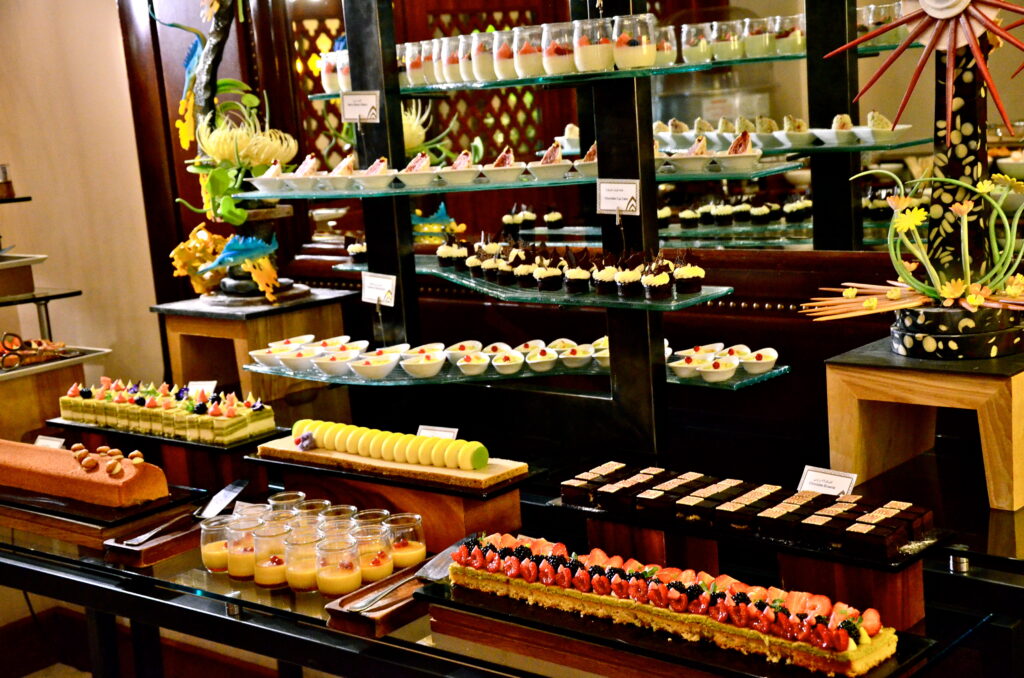 Family enjoying Easter brunch by Burj Khalifa with colorful decorations and eggs