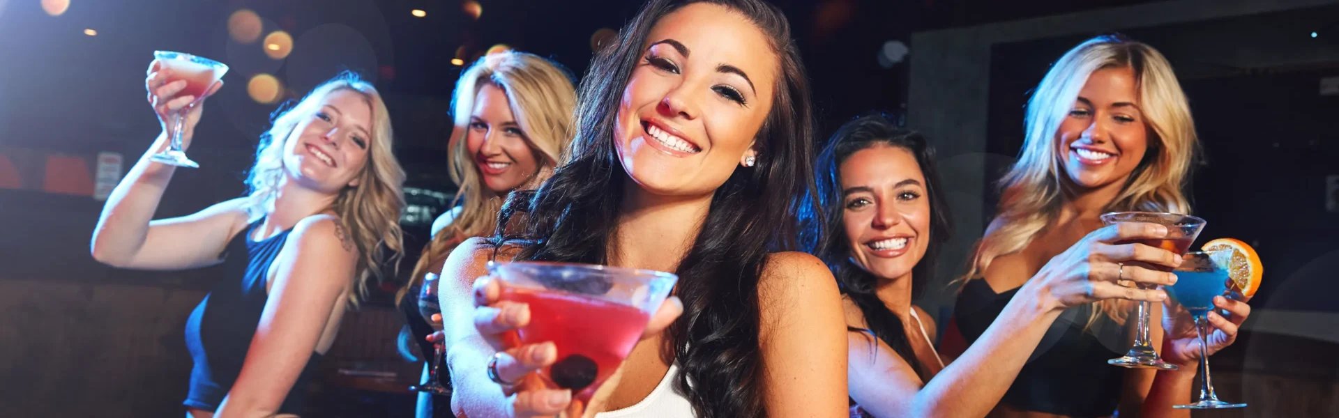 Women enjoying drinks and dancing during Thursday night ladies nights in Dubai, 2025.