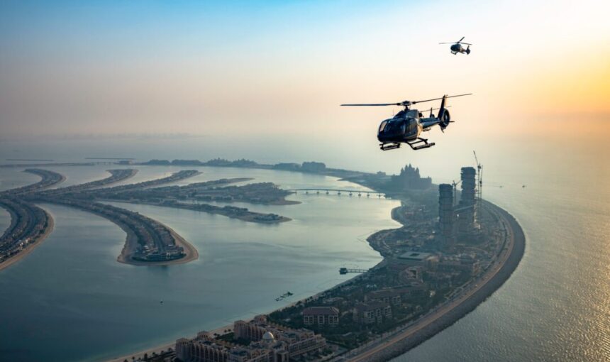 DubaiHelicopterSightseeingTrip-Klook › Forever Tourism LLC Helicopter Dubai flying above Burj Khalifa during a scenic tour in 2025