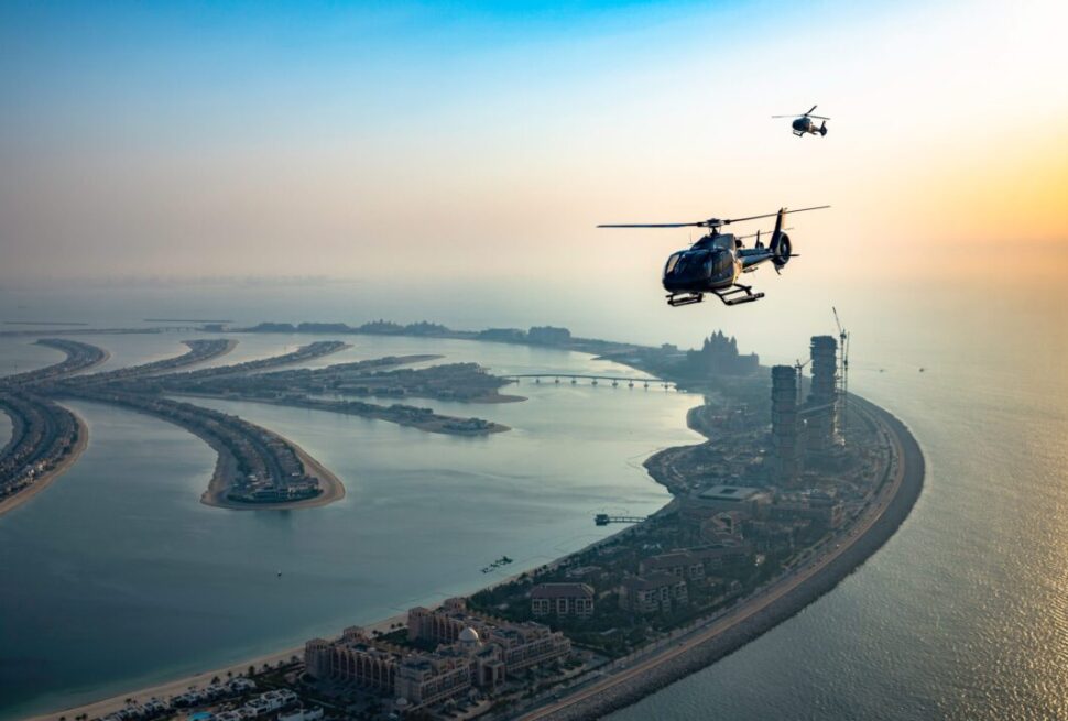 DubaiHelicopterSightseeingTrip-Klook › Forever Tourism LLC Helicopter Dubai flying above Burj Khalifa during a scenic tour in 2025
