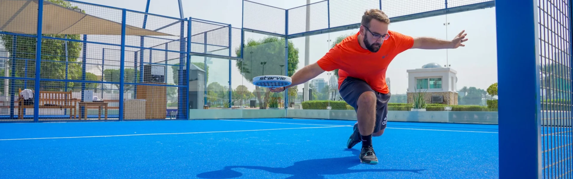 Modern outdoor Padel Tennis courts in Dubai with skyline in the background