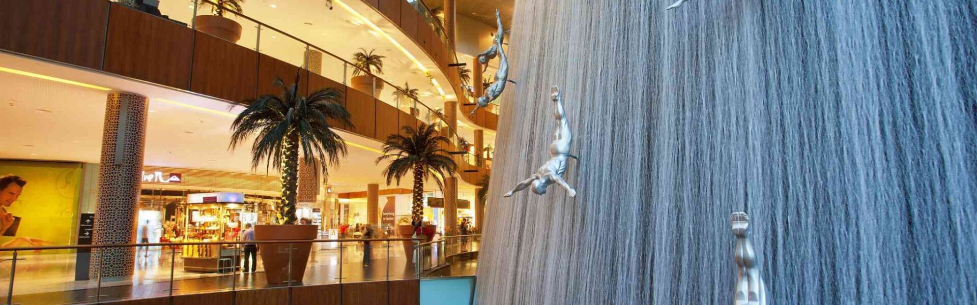 Exciting activities inside Dubai Mall including shopping, aquarium visits, ice rink, and entertainment with Forever Tourism guidance