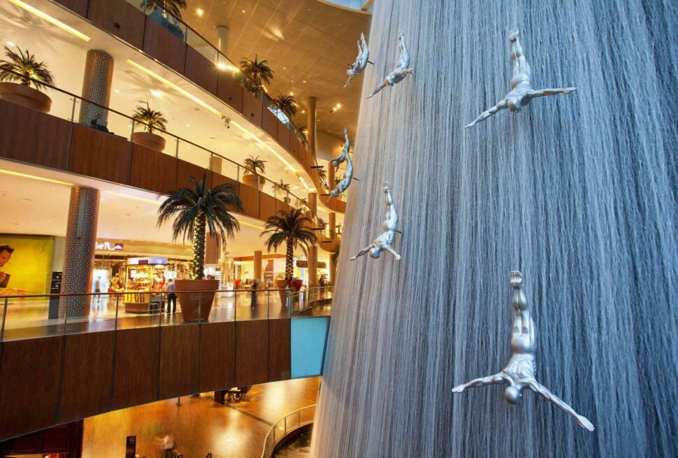 Exciting activities inside Dubai Mall including shopping, aquarium visits, ice rink, and entertainment with Forever Tourism guidance