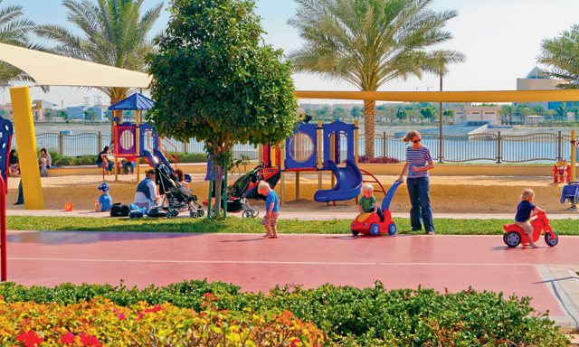 Children playing in top-rated playgrounds for kids in the UAE, surrounded by safe, modern play structures.