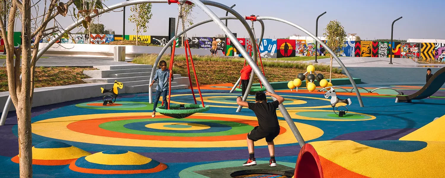 Children playing in top-rated playgrounds for kids in the UAE, surrounded by safe, modern play structures.