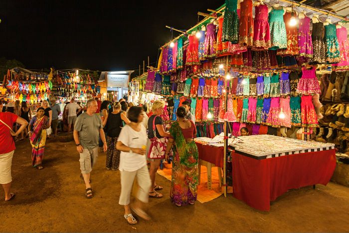 Ramadan markets in Dubai at night with lanterns, food stalls, and families shopping