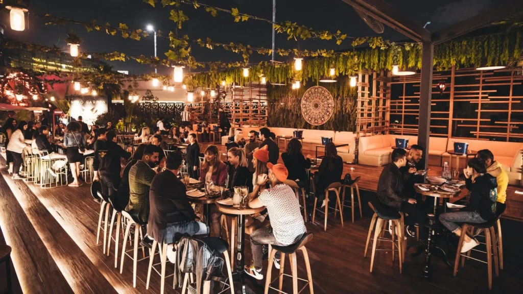 Luxurious rooftop lounges in Dubai with city skyline at night