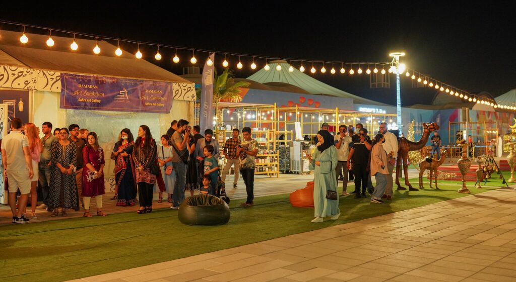 Ramadan markets in Dubai at night with lanterns, food stalls, and families shopping