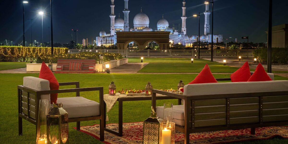 Ramadan in Abu Dhabi – Iftar tent with lanterns, dates, and sunset backdrop