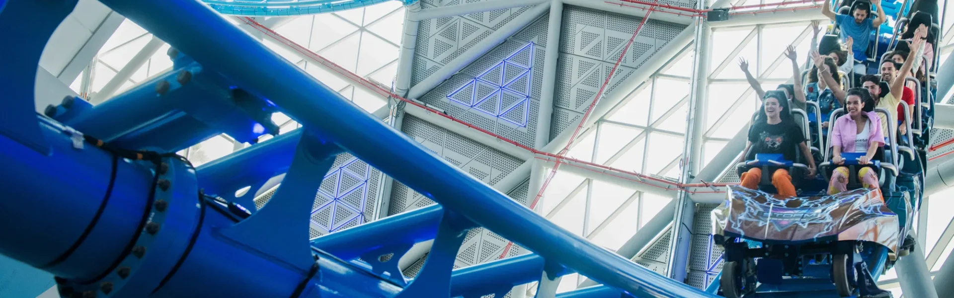 › Forever Tourism LLC Exciting roller coaster experiences in Dubai with riders enjoying thrilling rides and breathtaking views