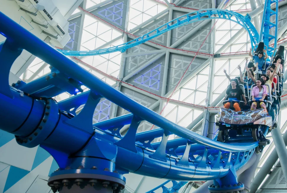 Exciting roller coaster experiences in Dubai with riders enjoying thrilling rides and breathtaking views