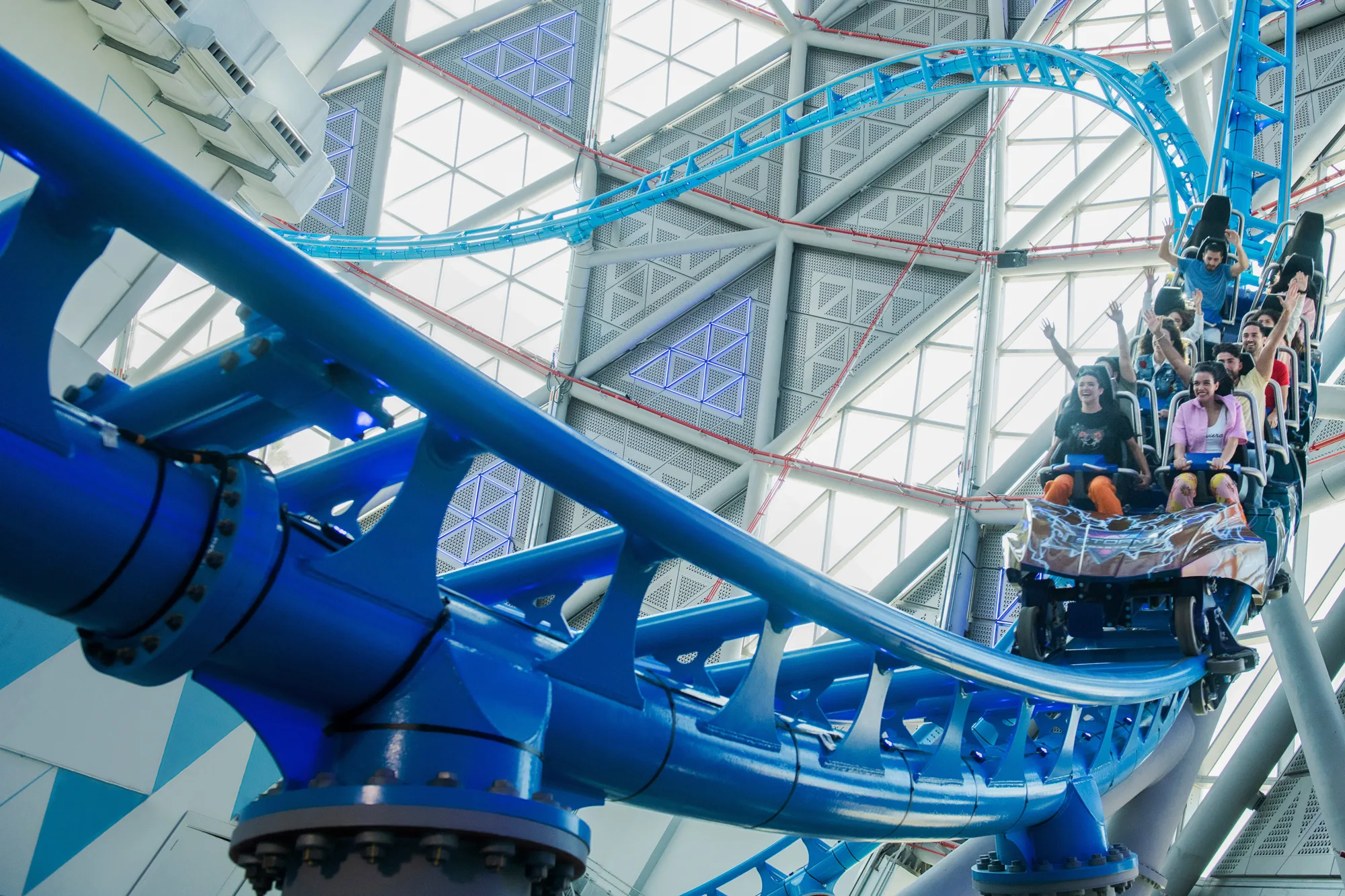 Exciting roller coaster experiences in Dubai with riders enjoying thrilling rides and breathtaking views