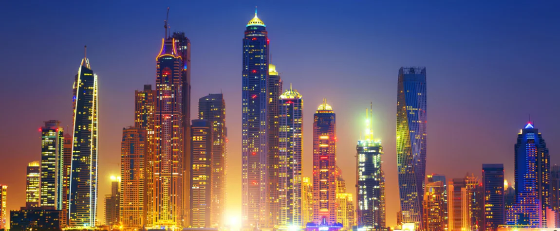 Night skyline of Abu Dhabi featuring iconic buildings and top-rated things to do in Abu Dhabi after dinner.