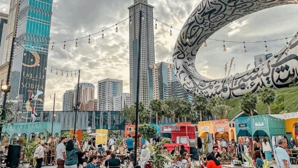 Ramadan markets in Dubai at night with lanterns, food stalls, and families shopping