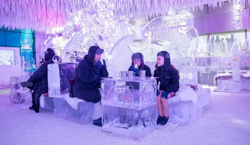 Tourists enjoying top Things to Do in Dubai in August including indoor attractions and summer activities.