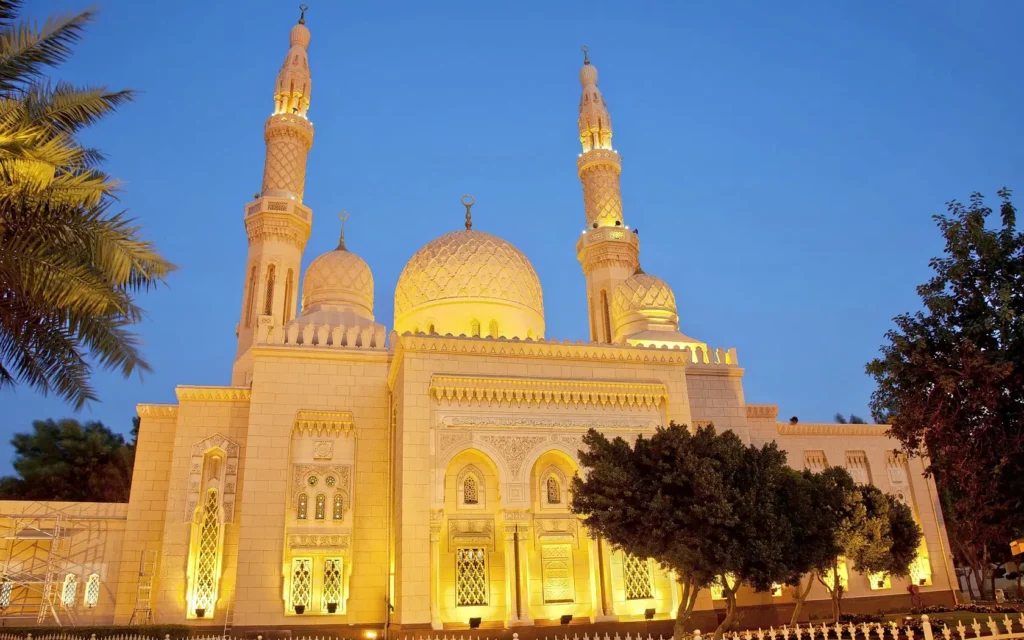 › Forever Tourism LLC Grand domes and marble courtyard at one of the top mosques to visit in the UAE
