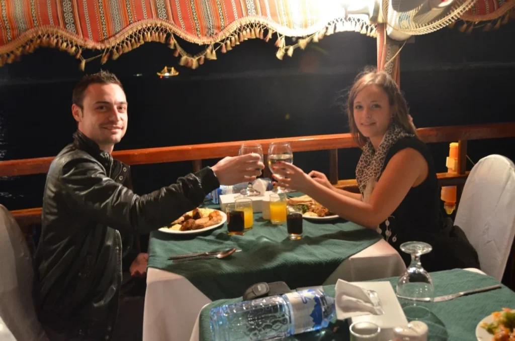Traditional dhow cruise creek with dinner under Dubai’s evening skyline