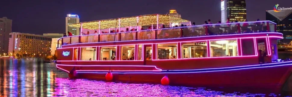 Traditional dhow cruise creek with dinner under Dubai’s evening skyline