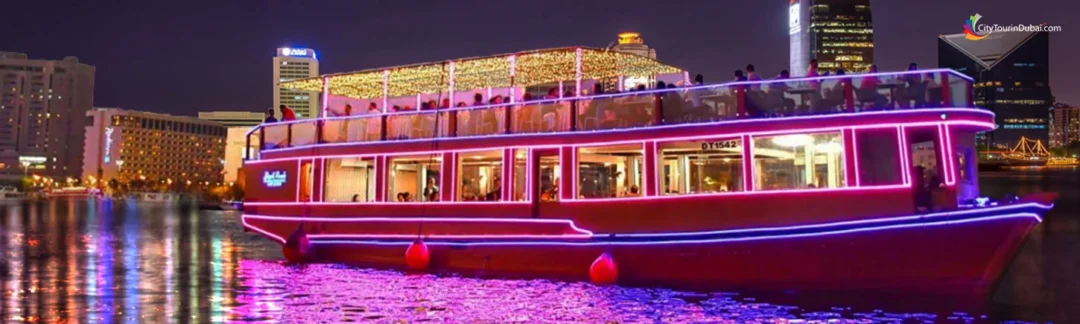 Traditional dhow cruise creek with dinner under Dubai’s evening skyline