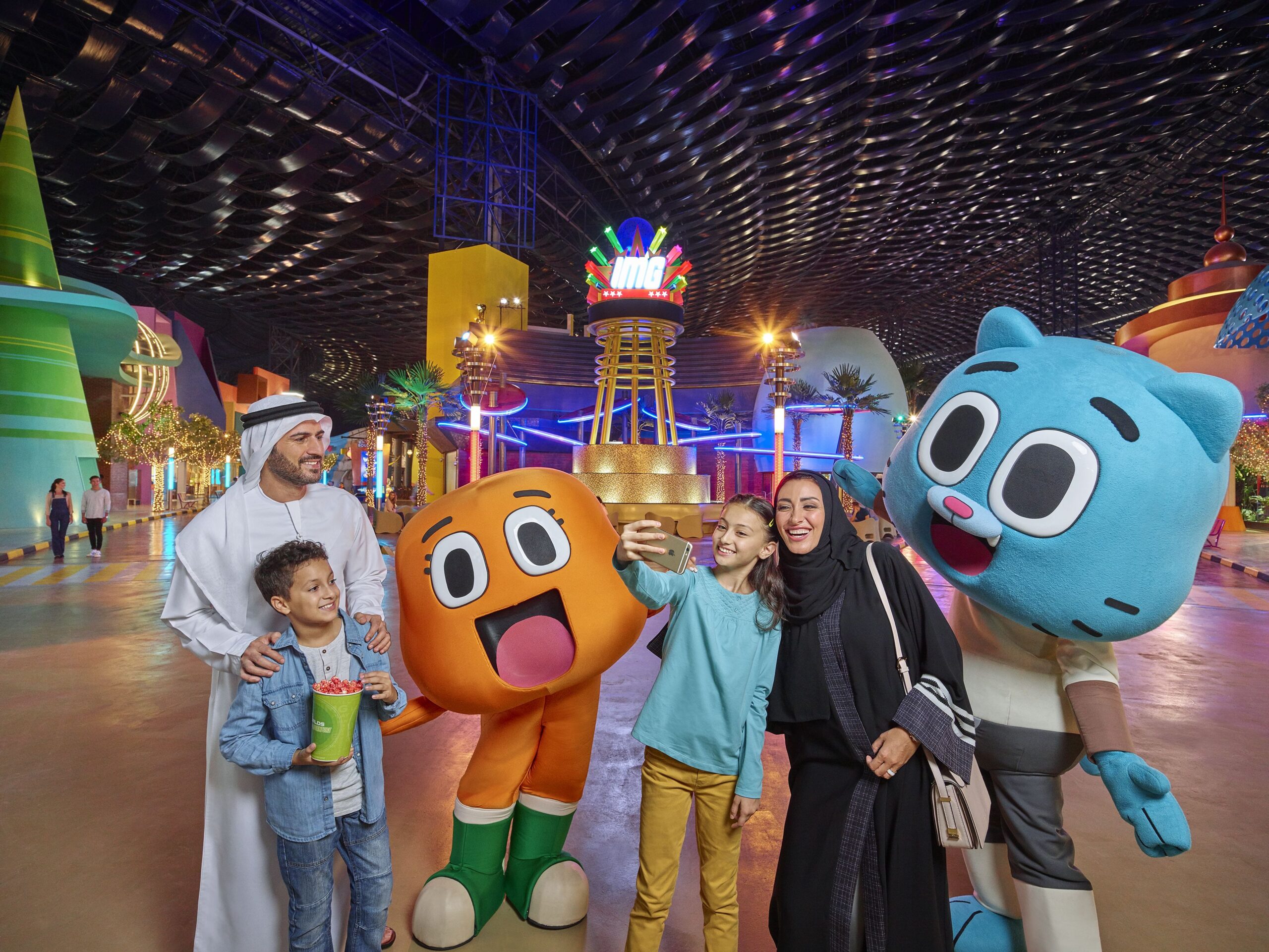 Families enjoying thrilling attractions at IMG Worlds of Adventure with IMG Theme Park Tickets, including IMG Tickets, IMG Park Tickets, and IMG World Ticket.