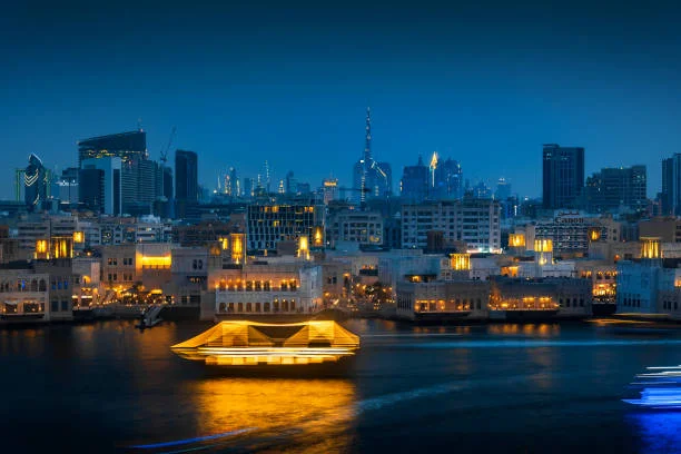 Creek Dhow Cruise during sunset with dinner setup on Dubai Creek
