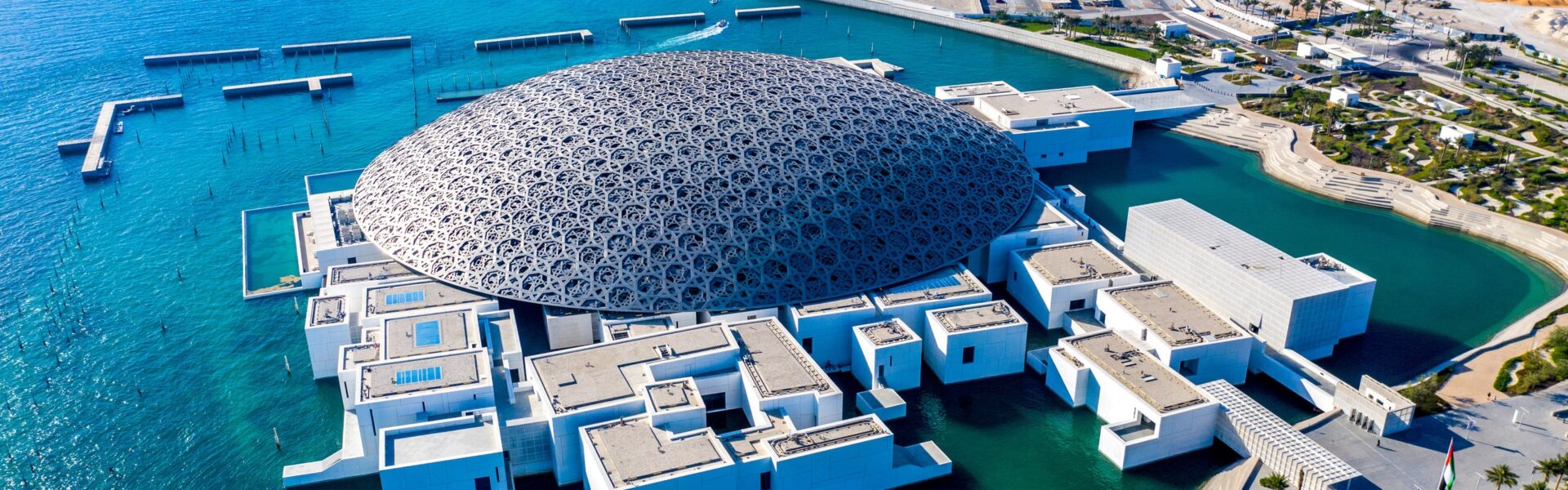 › Forever Tourism LLC Beautiful view of attractions near Abu Dhabi's Louvre Museum including gardens and cultural sites